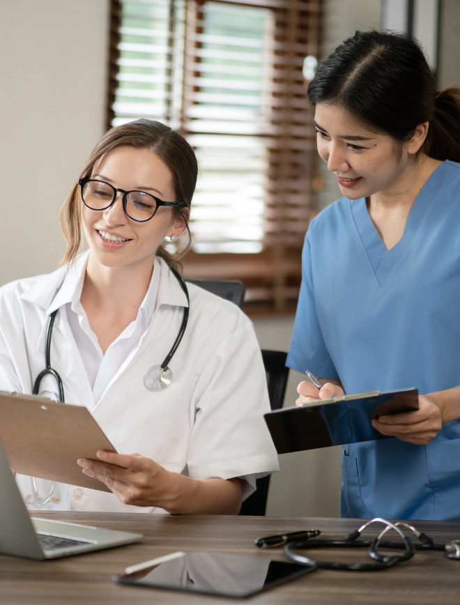 doctor and nurse looking over documents