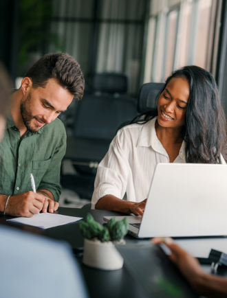 couple signs financial documents