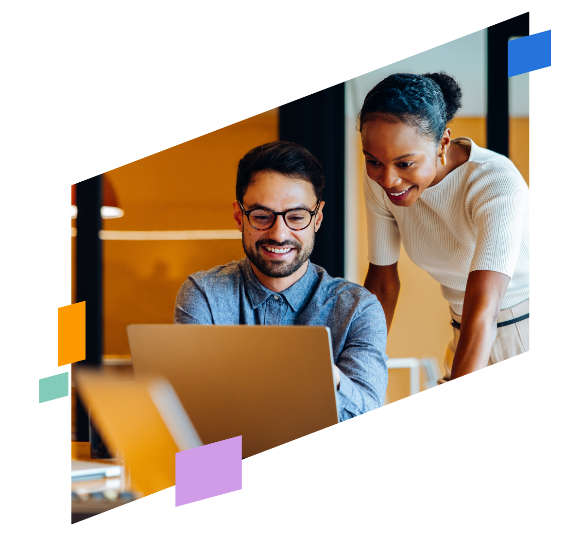 coworkers talking over laptop