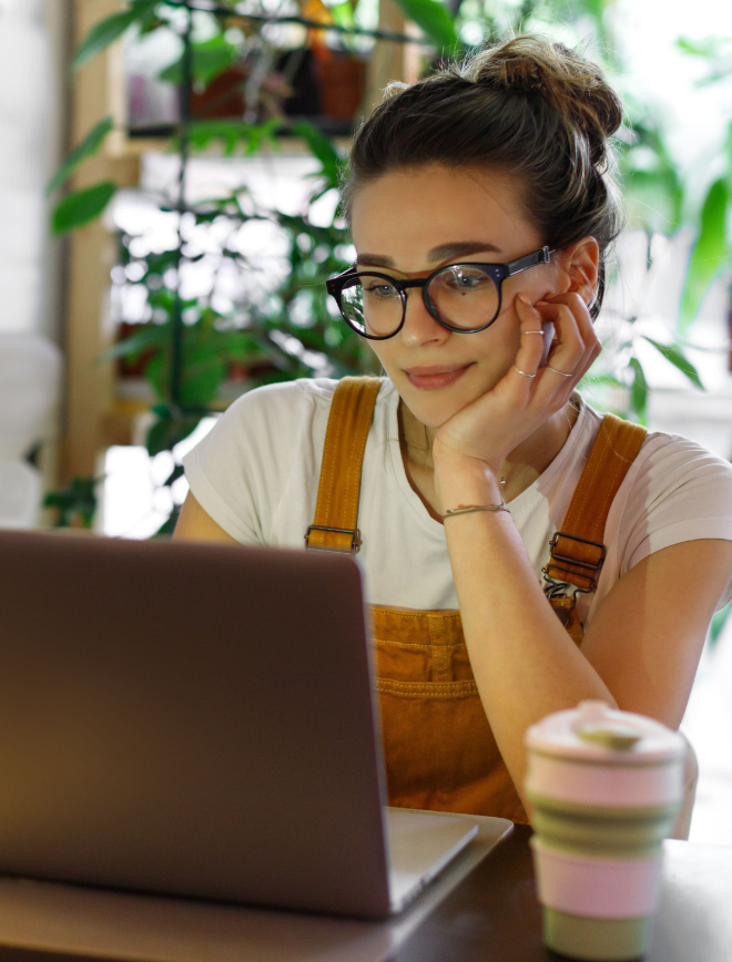 woman working on laptop at coffee shop