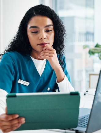 medical staff with tablet and laptop