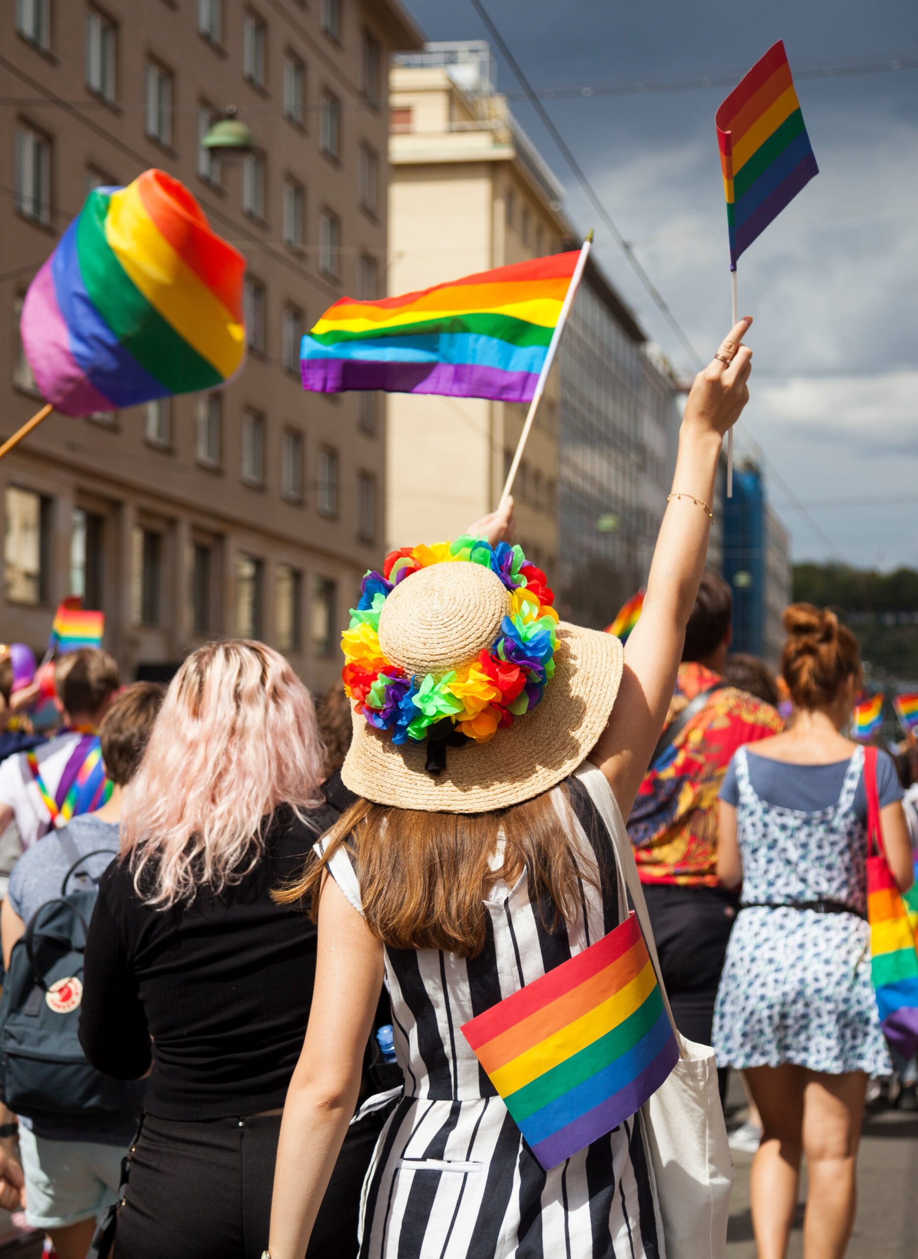 marchers in lgbtq pride parade through city