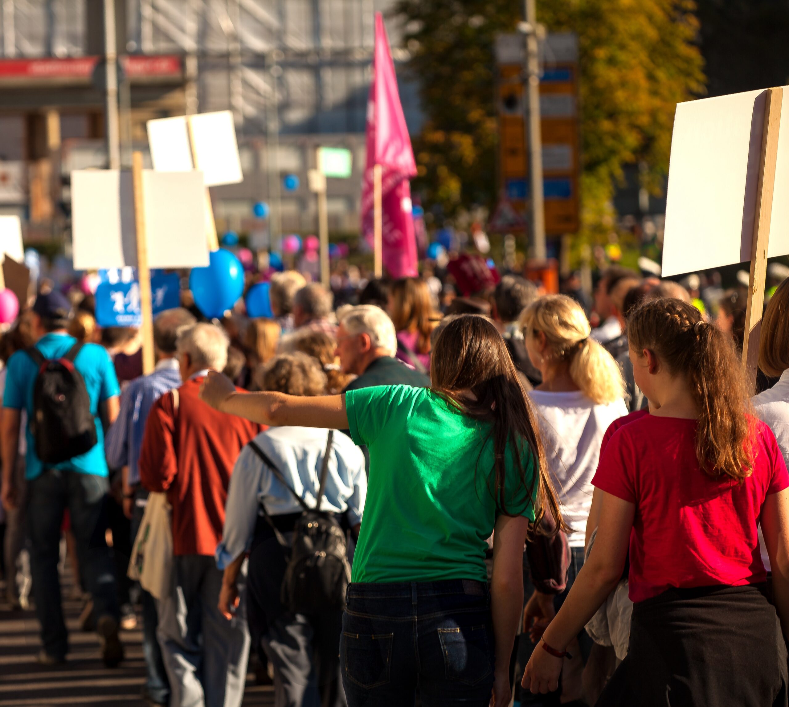 group of people in a labor protest with signs