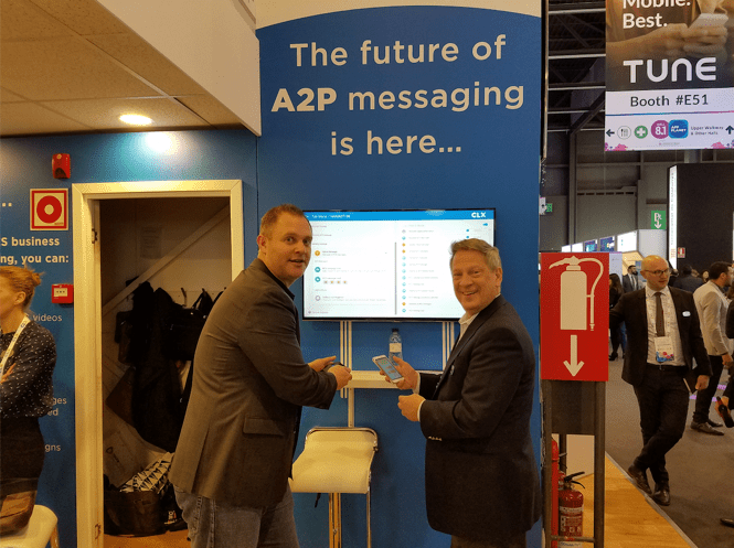 Matt Silk, head of strategy at Waterfall, and Bruce Bales, VP of Operation, Americas, standing in-front of the RCS demo at Mobile World Congress