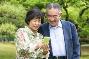 Senior couple looking at phone